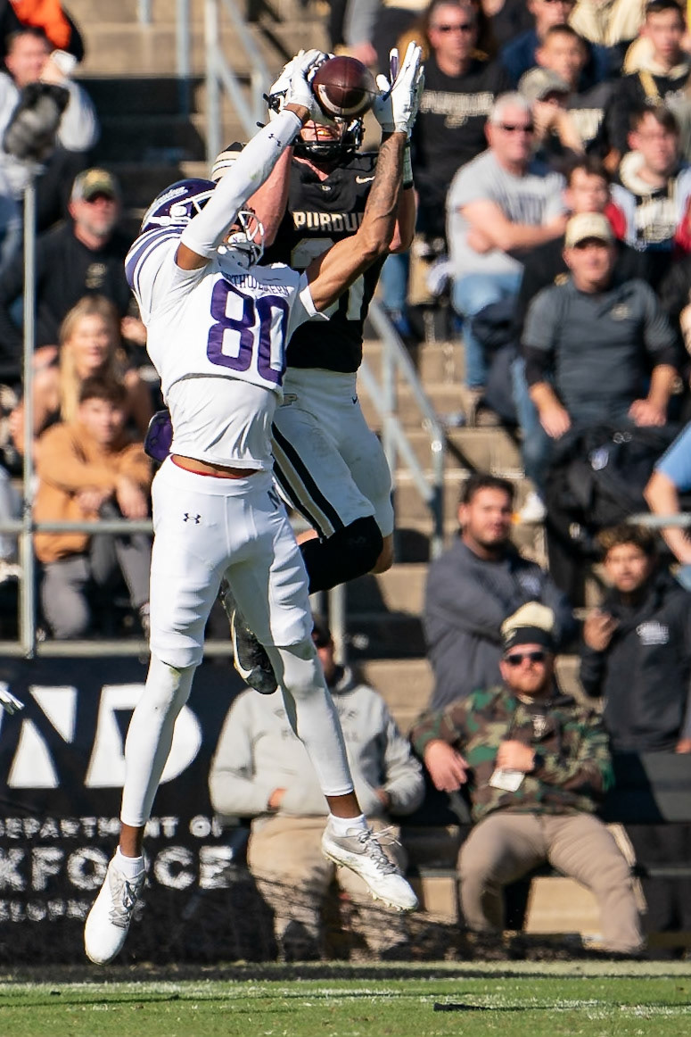 WEST LAFAYETTE, IN - NOVEMBER 2, 2024: Northwestern University Wide Receiver Hayden Eligon II (80) goes up for the hail mary while Purdue University Sophomore Defensive Back Dillon Thieneman (31) trys to get the interception during the Purdue University Boilermakers vs Northwestern University Wildcats Football game at Ross-Ade Stadium(Photo by Steve Bowen / Bowen Arrow Photography / Northern Indiana Sports Report)