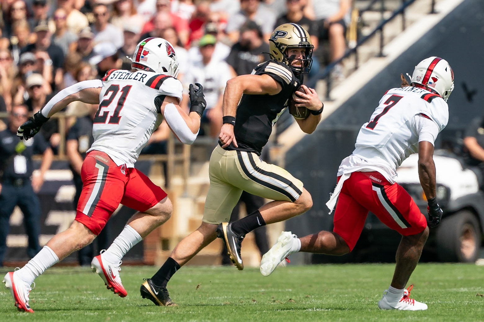 WEST LAFAYETTE, IN - AUGUST 30, 2025: Purdue University Sophomore Quaterback Ryan Browne (15) trying to elusde Ball State University R-Jr. DB Ashton Whitner (7) and Ball State University R-Sr. LB Joey Stemler (21) at Purdue Boilermaker Football vs Ball State Football at Ross-Ade Stadium(Photo by Steve Bowen / Northern Indiana Sports Report)