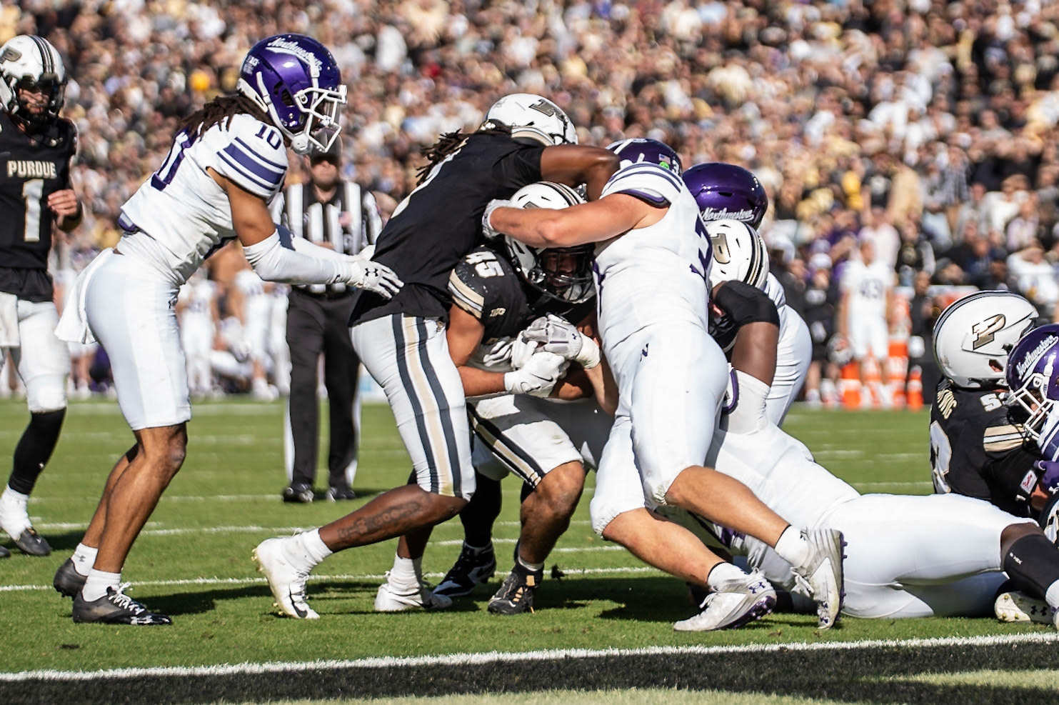 WEST LAFAYETTE, IN - NOVEMBER 2, 2024: Purdue University Junior Running Back Devin Mockobee (45) pushes towards the goal line while Purdue University Junior Wide Receiver Jahmal Edrine (7) trys to block Northwestern University Linebacker Mac Uihlein (37) during the Purdue University Boilermakers vs Northwestern University Wildcats Football game at Ross-Ade Stadium(Photo by Steve Bowen / Bowen Arrow Photography / Northern Indiana Sports Report)