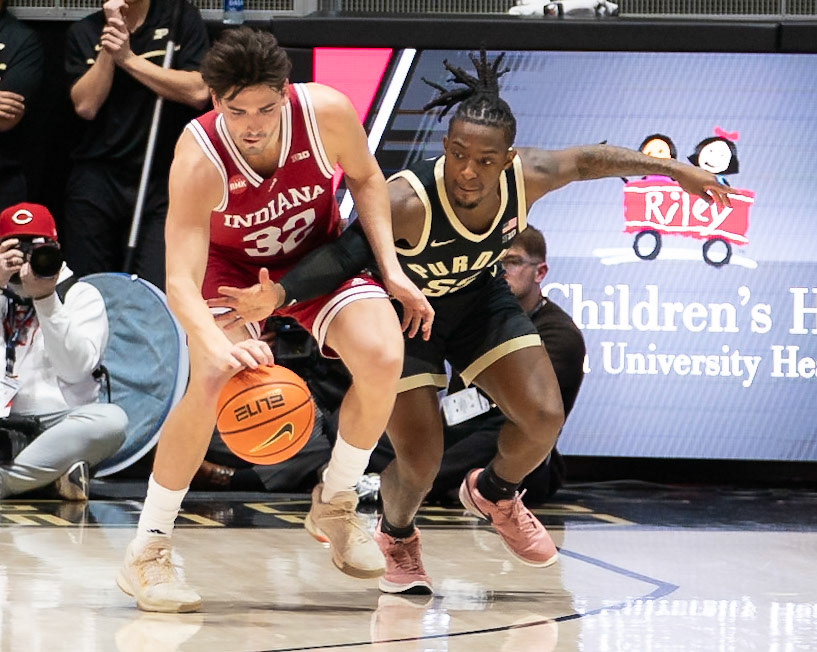 WEST LAFAYETTE, IN - FEBRUARY 10, 2024: Indiana Senior Guard Trey Galloway (32), Purdue 5th year Guard Lance Jones (55) in Purdue Boilermaker vs Indiana Hoosiers Basketball at Mackey Arena(Photo by Steve Bowen / Bowen Arrow Photography / Northern Indiana Sports Report)