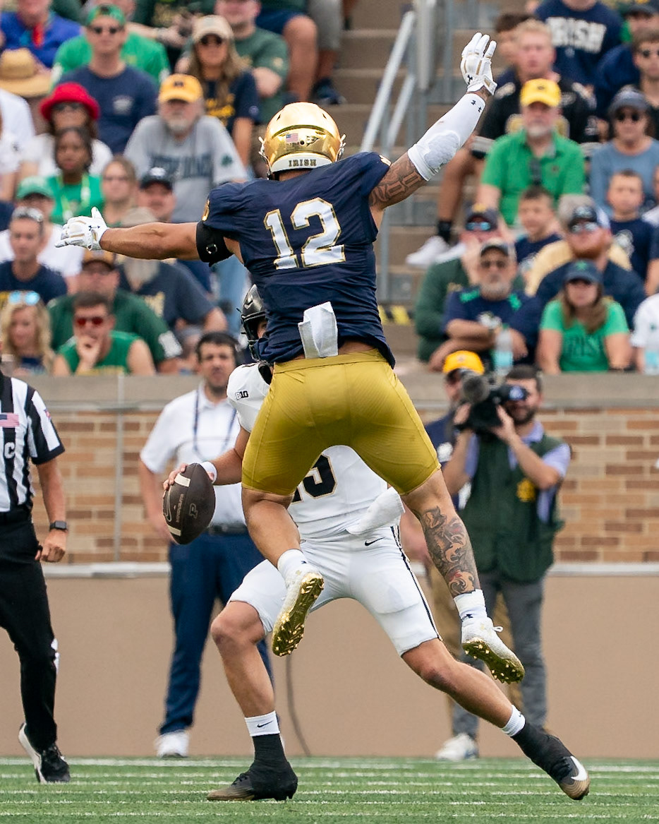 SOUTH BEND, IN - SEPTEMBER 20, 2025: Notre Dame University's Senior DL Jordan Botelho (12) Leaping to stop Purdue University's Sophomore Quaterback Ryan Browne (15) from being able to pass during the Purdue Boilermakers at Notre Dame Fighting Irish Football at Notre Dame Stadium(Photo by Steve Bowen / Northern Indiana Sports Report)