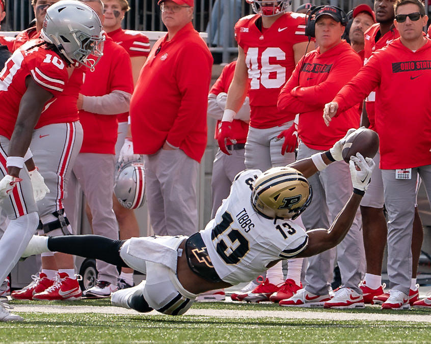 COLUMBUS UNIVERSITY, OH - NOVEMBER 9, 2024: Purdue University Sophomore Wide Receiver Jaron Tibbs (13) makes a figer tip catch as Ohio State University Senior Cornerback Denzel Burke (10) looks on in Purdue University Boilermakers at University of Ohio Buckeyes Football game at Ohio Stadium(Photo by Steve Bowen / Bowen Arrow Photography / Northern Indiana Sports Report)