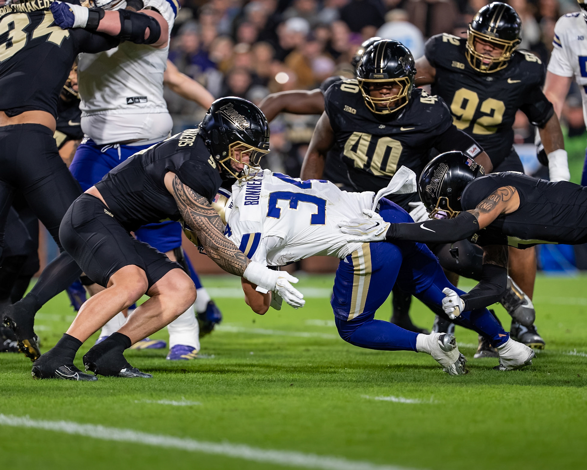 WEST LAFAYETTE, IN - OCTOBER 16, 2026: University of Washington RB Brian Bonner Jr. (34), Purdue University Junior Linebacker Jojo Hayden (0), Purdue University Junior Linebacker Charles Correa (5) during the Purdue Boilermakers vs Washington Huskies football game at Ross-Ade Stadium(Photo by Steve Bowen / Northern Indiana Sports Report)