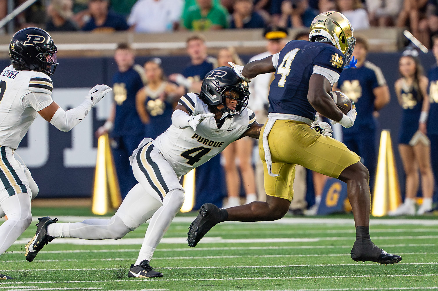 SOUTH BEND, IN - SEPTEMBER 20, 2025: Notre Dame University Junior RB Jeremiyah Love (4) stiff arms Purdue University's Sophomore Defensive Back Hudauri Hines (4) during the Purdue Boilermakers at Notre Dame Fighting Irish Football at Notre Dame Stadium(Photo by Steve Bowen / Northern Indiana Sports Report)