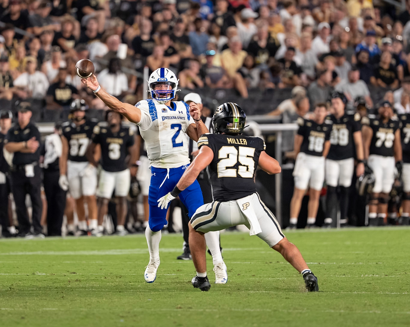 WEST LAFAYETTE, IN - SEPTEMBER 4, 2026: Indiana State University Quarterback Elijah Owens (2)throws a pass while Purdue University Junior Linebacker Hudson Miller (25) chases him down during the Purdue Boilermaker Football game vs the Indiana State Sycamores at Ross-Ade Stadium(Photo by Steve Bowen / Northern Indiana Sports Report)