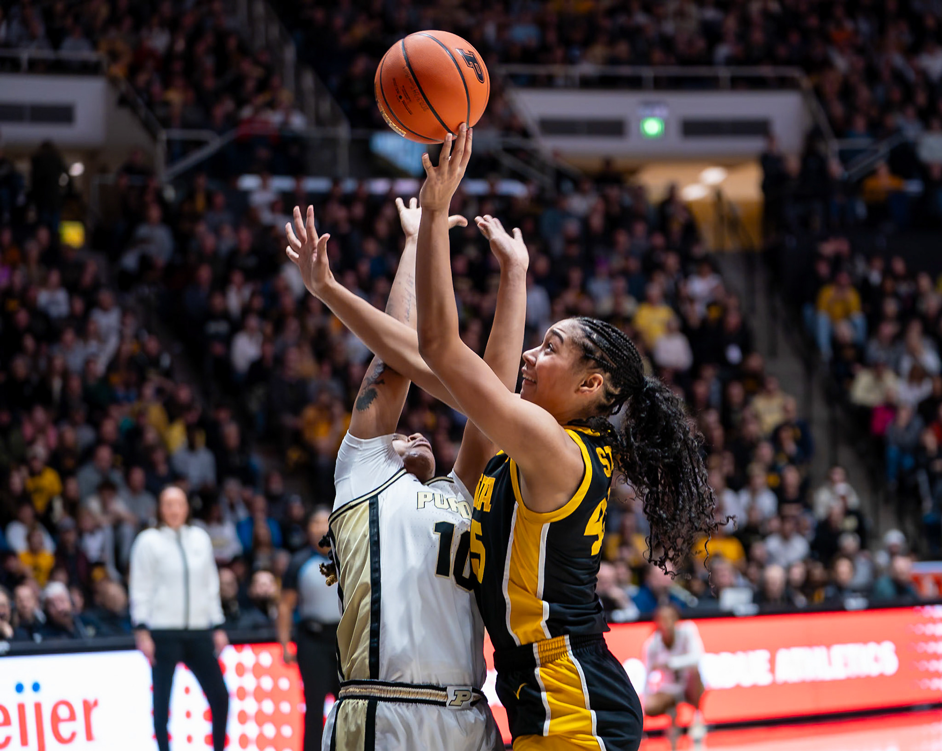 WEST LAFAYETTE, IN - JANUARY 10, 2024: Purdue 5th Year Guard Jeanae Terry (10), Iowa Forward Sophomore Hannah Stuelke (45) competing in Purdue Boilermaker Women's Basketball vs the Iowa Hawkeyes at Mackey Arena(Photo by Steve Bowen / Bowen Arrow Photography / Northern Indiana Sports Report)