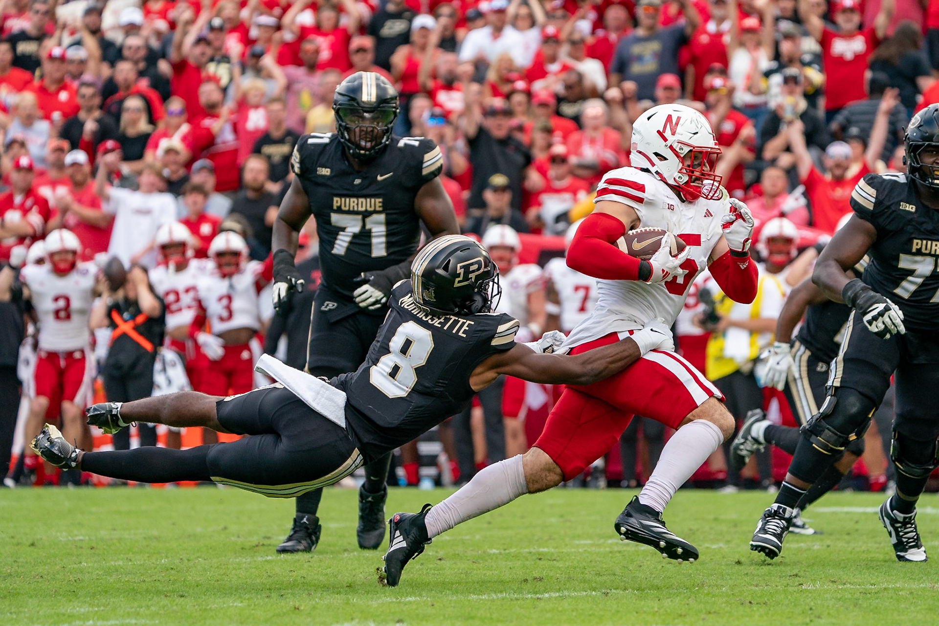 WEST LAFAYETTE, IN - SEPTEMBER 28, 2024: Nebraska University Senior Linebacker John Bullock (5), Purdue University Sophomore Wide Receiver De'Nylon Morrissette (8) during the Purdue University Boilermakers vs Nebraska University Cornhuskers Football game at Ross-Ade Stadium(Photo by Steve Bowen / Bowen Arrow Photography / Northern Indiana Sports Report)