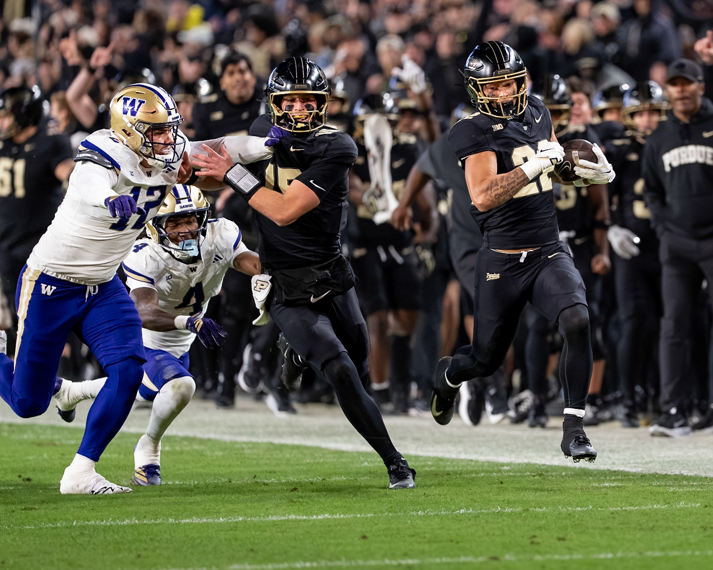 WEST LAFAYETTE, IN - OCTOBER 16, 2026: Purdue University Freshman Running Back Antonio Harris (22), Purdue University Quarterback Ryan Browne (15), University of Washington EDGE Logan George (12) during the Purdue Boilermakers vs Washington Huskies football game at Ross-Ade Stadium(Photo by Steve Bowen / Northern Indiana Sports Report)