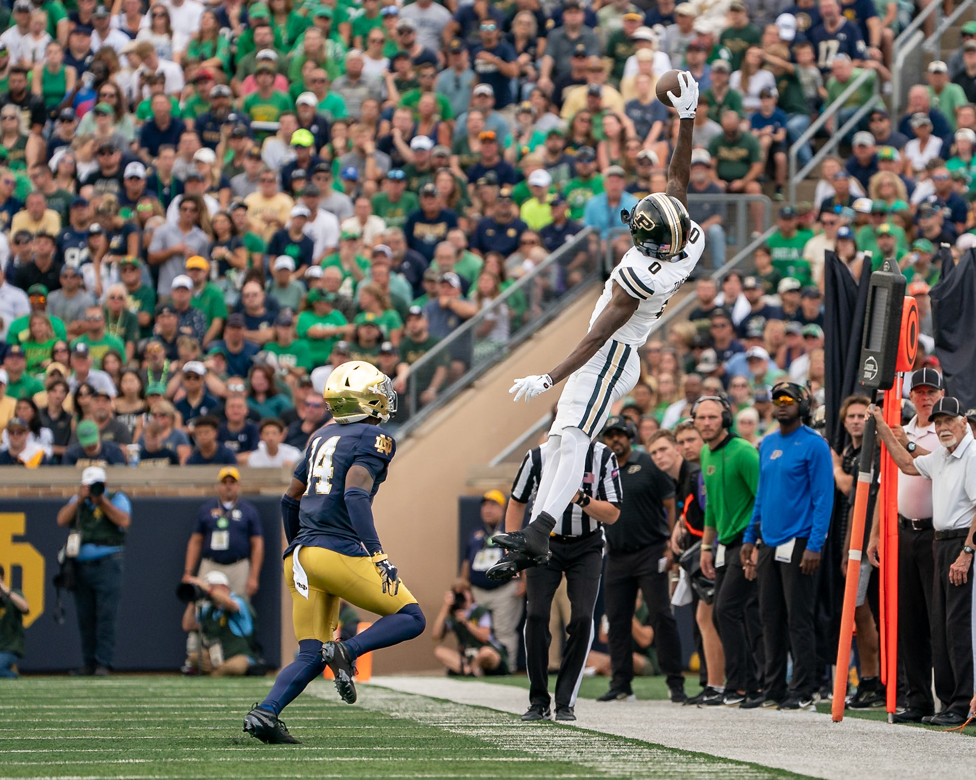 SOUTH BEND, IN - SEPTEMBER 20, 2025: Purdue University Sophomore Wide Receiver Nitro Tuggle (0) leaps high in the air in a catch attempt against Notre Dame University's Freshman CB Dallas Golden (14) in Purdue Boilermakers at Notre Dame Fighting Irish Football at Notre Dame Stadium(Photo by Steve Bowen / Northern Indiana Sports Report)