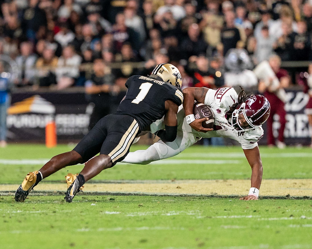 WEST LAFAYETTE, IN - SEPTEMBER 6, 2025: Southern Illinois University Sr. QB DJ Williams (1) drilled into the gournd by Purdue University Sophomore Defensive Back Smiley Bradford (1) at Purdue Boilermaker Football vs Southern Illinois Saluki Football at Ross-Ade Stadium(Photo by Steve Bowen / Northern Indiana Sports Report)