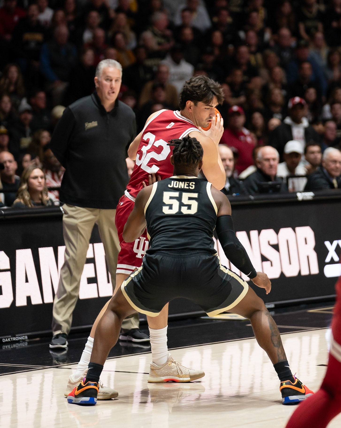 WEST LAFAYETTE, IN - FEBRUARY 10, 2024: Indiana Senior Guard Trey Galloway (32), Purdue 5th year Guard Lance Jones (55) in Purdue Boilermaker vs Indiana Hoosiers Basketball at Mackey Arena(Photo by Steve Bowen / Bowen Arrow Photography / Northern Indiana Sports Report)