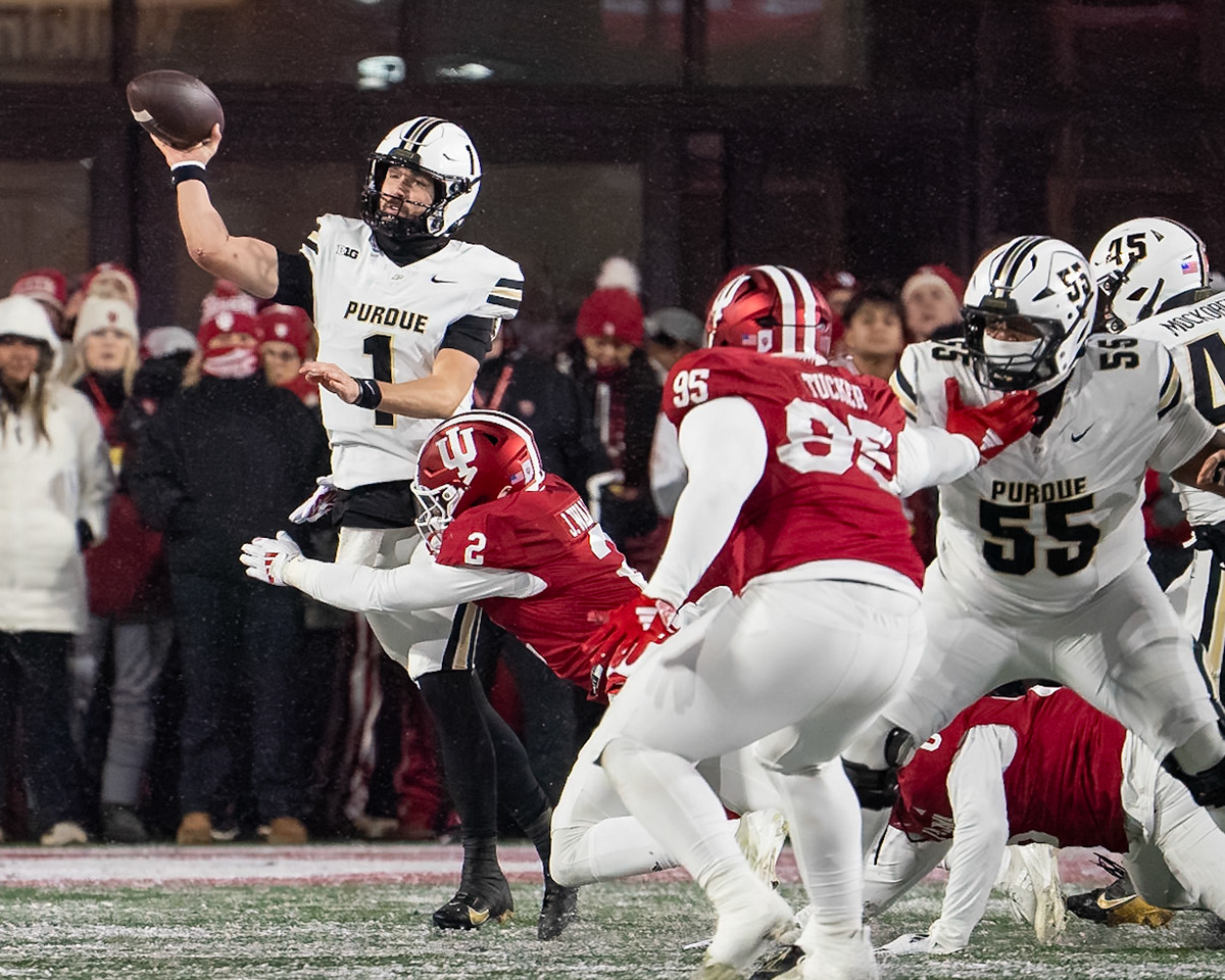 BLOOMINGTON, IN - NOVEMBER 30, 2024: Purdue University Senior Quaterback Hudson Card (1), Indiana University Senior LB Jailin Walker (2) during the Purdue University Boilermakers at Indiana University Hoosiers Football game at Memorial Stadium(Photo by Steve Bowen / Bowen Arrow Photography / Northern Indiana Sports Report)
