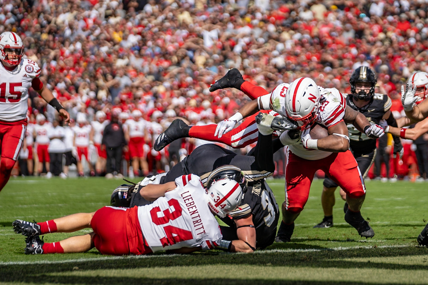 WEST LAFAYETTE, IN - SEPTEMBER 28, 2024: Nebraska University Sophomore Running Back Dante Dowdell (23), Nebraska University Junior Fullback Barret Liebentritt (34), Purdue University Sophomore Defensive Back Dillon Thieneman (31) during the Purdue University Boilermakers vs Nebraska University Cornhuskers Football game at Ross-Ade Stadium(Photo by Steve Bowen / Bowen Arrow Photography / Northern Indiana Sports Report)