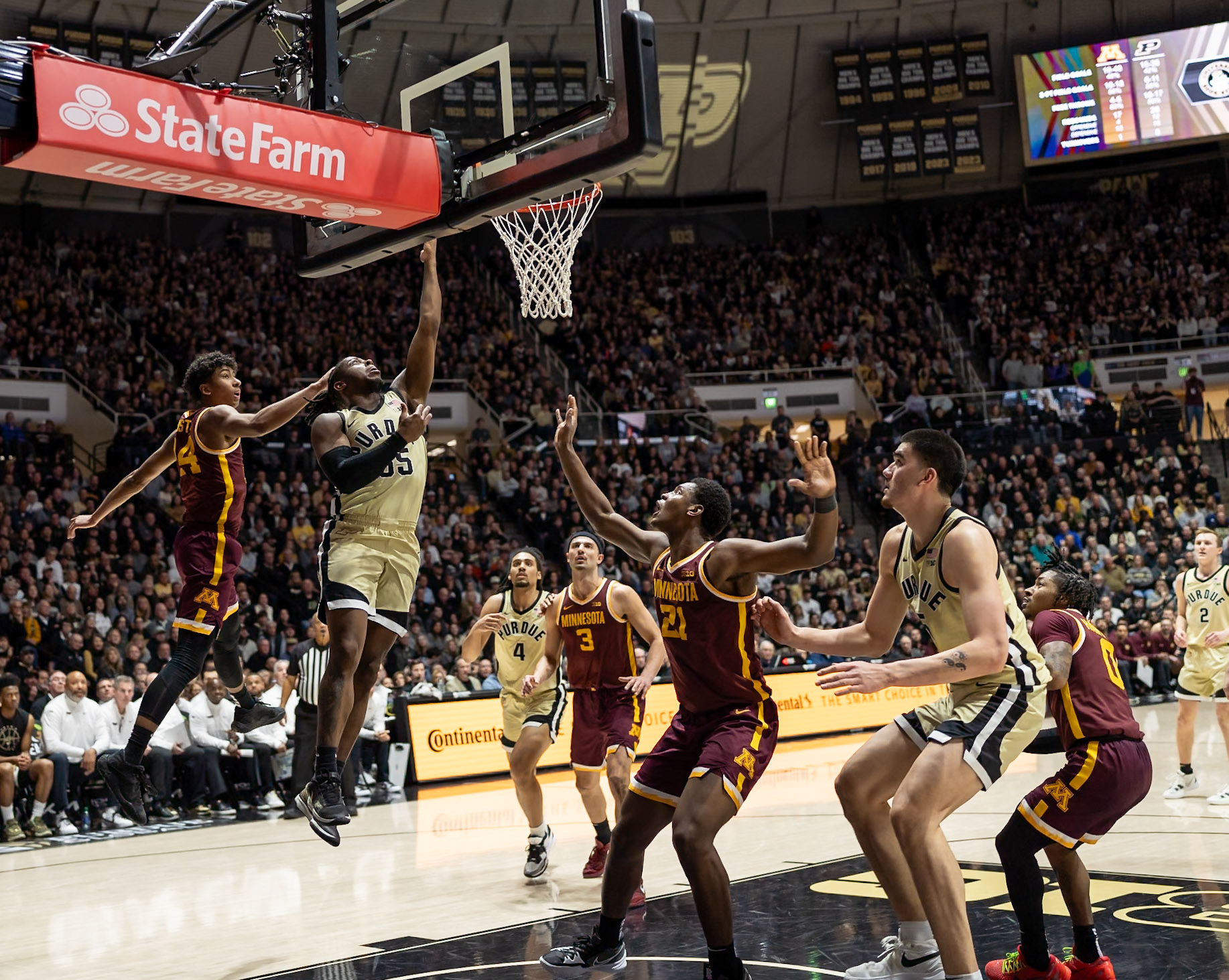 WEST LAFAYETTE, IN - FEBRUARY 15, 2024: Purdue 5th year Guard Lance Jones (55), Minnesota Freshman Guard Cam Christie (24) in Purdue Boilermakers Men's Basketball vs the Minnesota Golden Gophers at Mackey Arena(Photo by Steve Bowen / Bowen Arrow Photography / Northern Indiana Sports Report)
