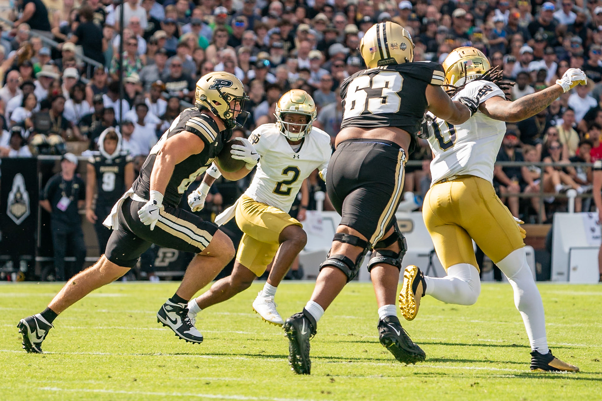 WEST LAFAYETTE, IN - SEPTEMBER 14, 2024: Purdue So. Tight End Max Klare (86), Notre Dame Senior S Xavier Watts (0), Notre Dame Grad Student S Rod Heard II (2), Purdue Jr. Offensive Lineman Marcus Mbow (63) during the Purdue University Boilermakers vs Notre Dame Fighting Irish Football game at Ross-Ade Stadium(Photo by Steve Bowen / Bowen Arrow Photography / Northern Indiana Sports Report)