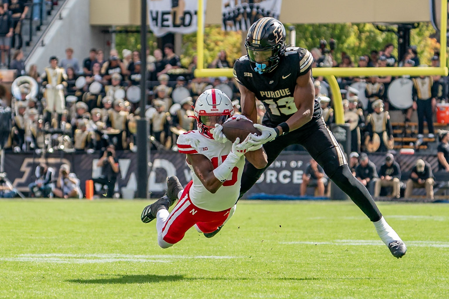 WEST LAFAYETTE, IN - SEPTEMBER 28, 2024: Purdue University Sophomore Wide Receiver Jaron Tibbs (13), Nebraska University Junior Defensive Back Ceyair Wright (15) during the Purdue University Boilermakers vs Nebraska University Cornhuskers Football game at Ross-Ade Stadium(Photo by Steve Bowen / Bowen Arrow Photography / Northern Indiana Sports Report)