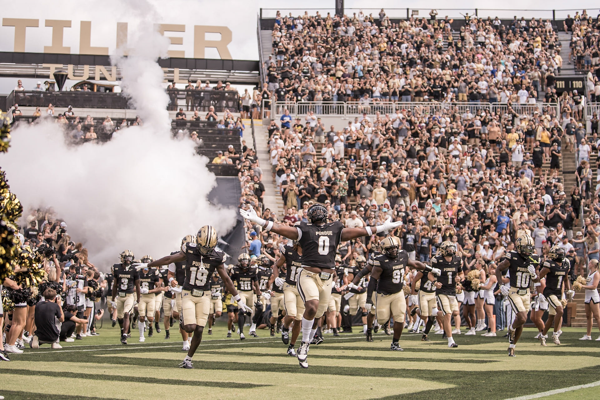 WEST LAFAYETTE, IN - AUGUST 31, 2024: Purdue Sr. DL Jeffrey M'Ba (0) and Purdue Jr. DB Botros Alisandro (19) run into Ross-Ade Stadium to start the 2024 season in the Purdue Boilermaker Football vs Indiana State Sycamores.(Photo by Steve Bowen / Bowen Arrow Photography / Northern Indiana Sports Report)