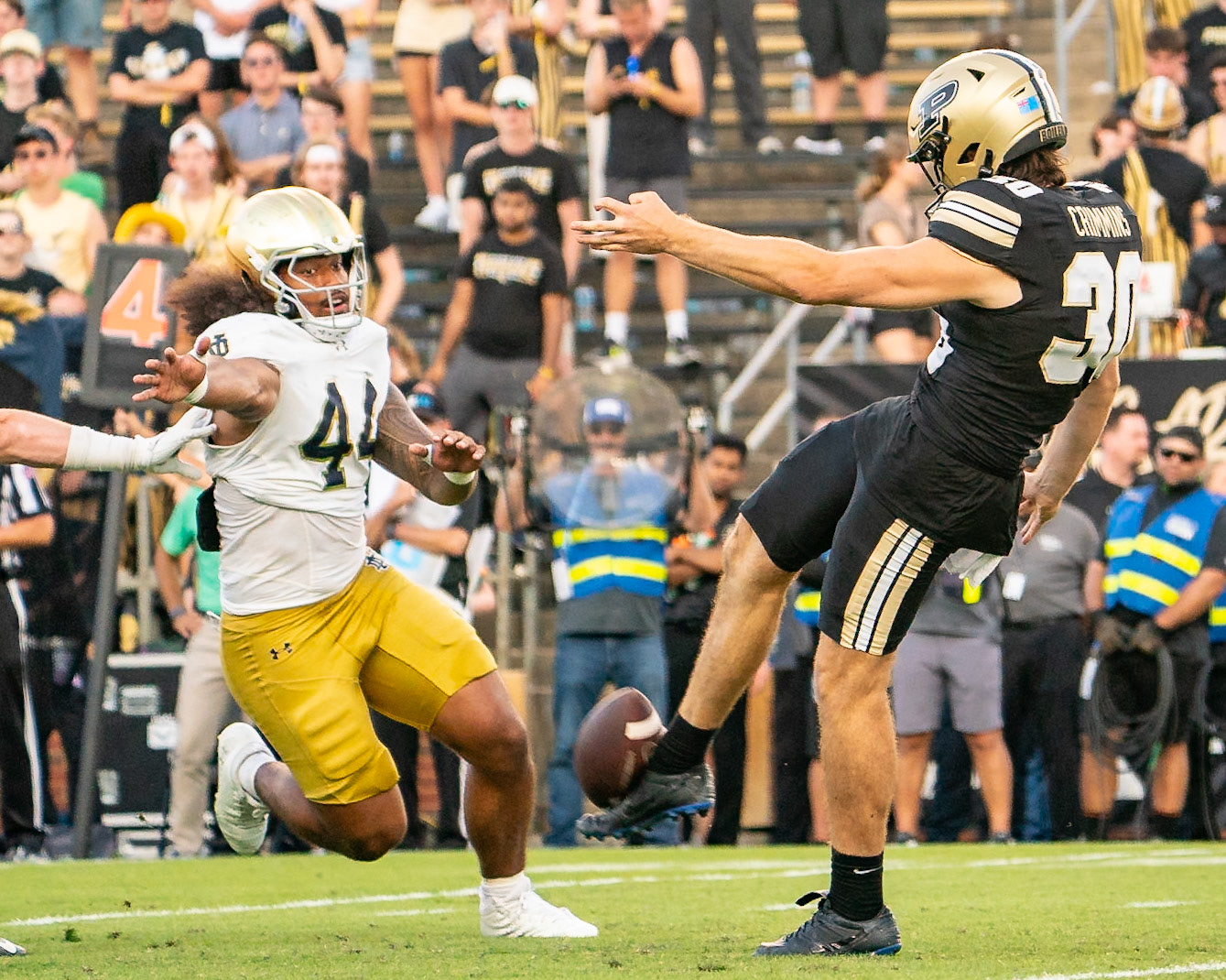 WEST LAFAYETTE, IN - SEPTEMBER 14, 2024: Purdue Jr. Punter Keelan Crimmins (30), Notre Dame Junior DL Junior Tuihalamaka (44) during the Purdue University Boilermakers vs Notre Dame Fighting Irish Football game at Ross-Ade Stadium(Photo by Steve Bowen / Bowen Arrow Photography / Northern Indiana Sports Report)