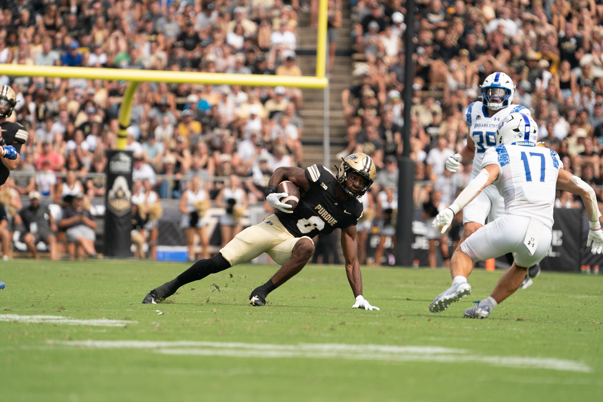 WEST LAFAYETTE, IN - AUGUST 31, 2024: Purdue So. WR De'Nylon Morrissette (8) catches his slide after a catch while trying to avoid Indiana State R-Jr. DB Maddix Blackwell (17) in Purdue Boilermaker Football vs Indiana State Sycamores at Ross-Ade Stadium(Photo by Steve Bowen / Bowen Arrow Photography / Northern Indiana Sports Report)