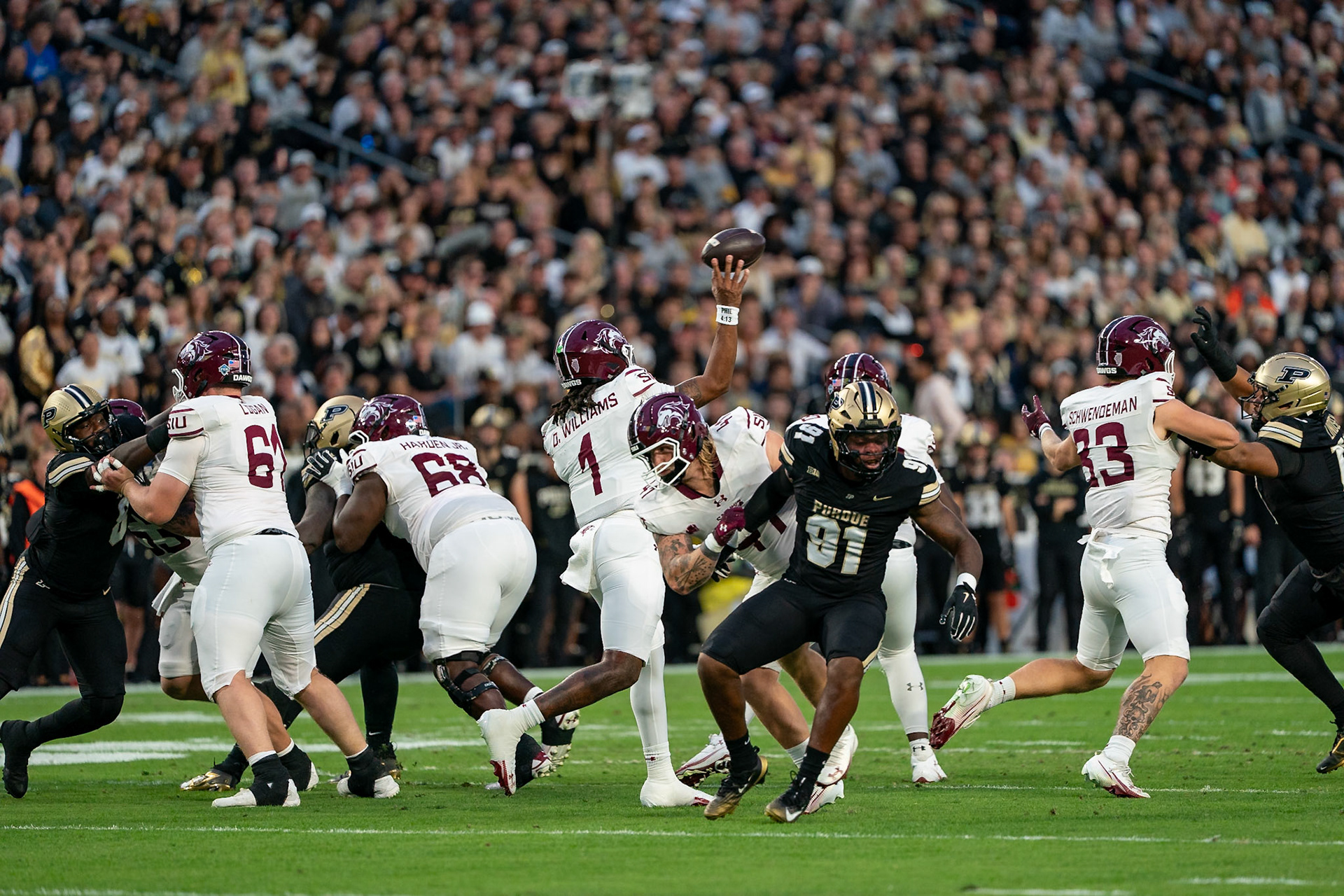 WEST LAFAYETTE, IN - SEPTEMBER 6, 2025: Southern Illinois University Sr. QB DJ Williams (1) throws a pass in the 1st quarter as Purdue University Senior Defensive Lineman CJ Nunnally IV (91) tries to avoid the block at Purdue Boilermaker Football vs Southern Illinois Saluki Football at Ross-Ade Stadium(Photo by Steve Bowen / Northern Indiana Sports Report)