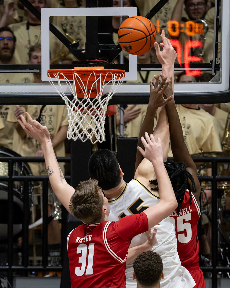 WEST LAFAYETTE, IN - MARCH 10, 2024: Purdue Senior Center Zach Edey (15), Wisconsin Freshman Forward Nolan Winter (31), Wisconsin Freshman Guard John Blackwell (25) competing in Purdue University Boilermaker Basketball vs University of Wisconsin Badgers at Mackey Arena(Photo by Steve Bowen / Bowen Arrow Photography / Northern Indiana Sports Report)