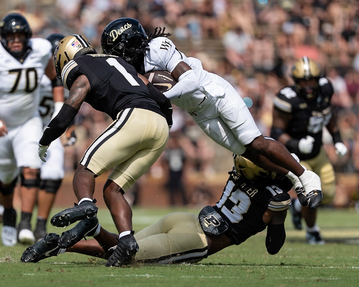WEST LAFAYETTE, IN - SEPTEMBER 12, 2026: Wake Forest University Wide Receiver Kam Shanks (5) geets sadnwiched between Purdue University Junior Defensive Back John Slaughter (13) and Purdue University Junior Defensive Back Smiley Bradford (1) during the Purdue Boilermakers football game vs the Wake Forest Demon Deacons at Ross-Ade Stadium(Photo by Steve Bowen / Northern Indiana Sports Report)