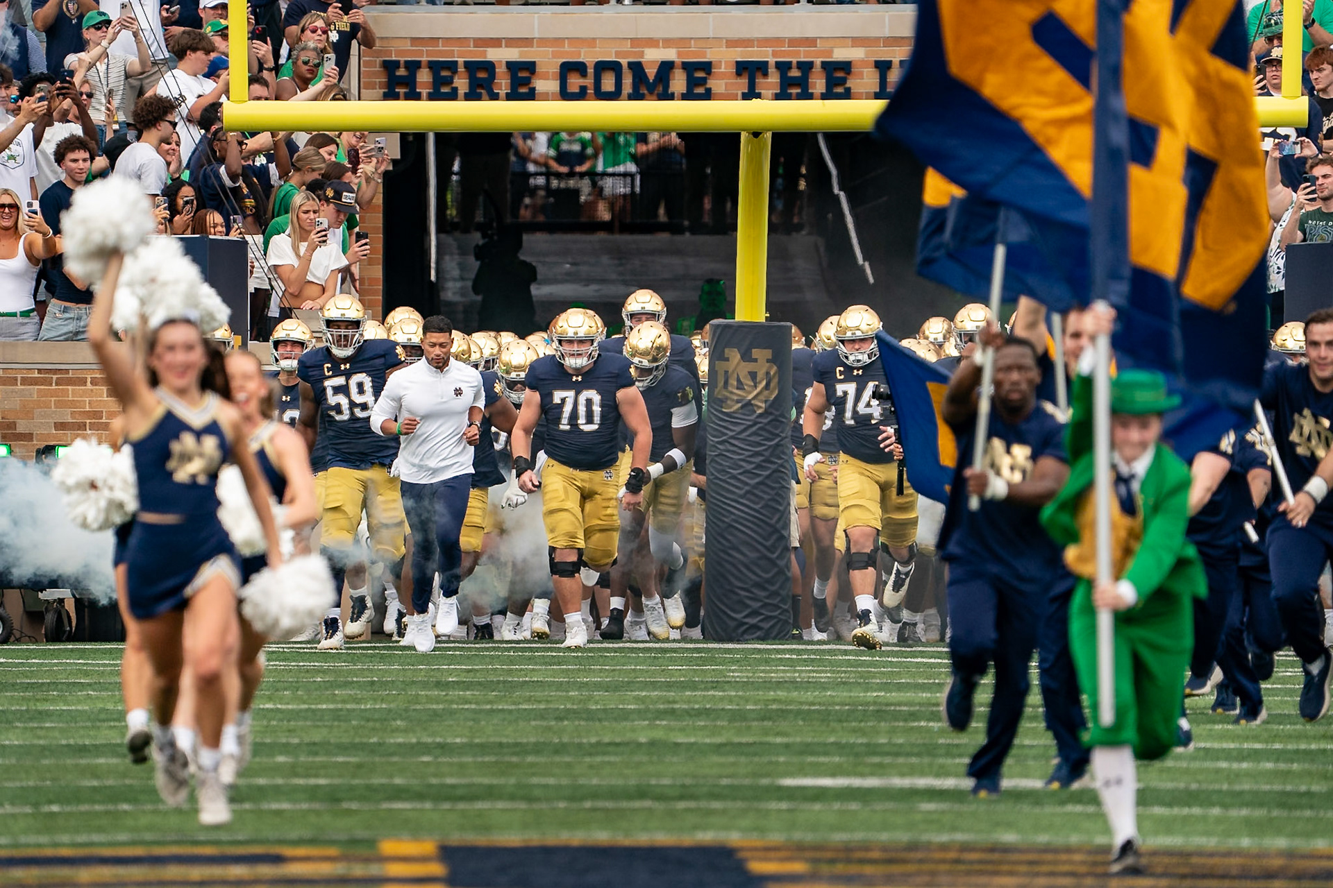 SOUTH BEND, IN - SEPTEMBER 20, 2025: Notre Dame University Football Head Coach Marcus Freeman, Notre Dame University Junior OL Ashton Craig (70), and Notre Dame University Junior OL Aamil Wagner (59) lead the team out of the tunnel before the Purdue Boilermakers at Notre Dame Fighting Irish Football at Notre Dame Stadium(Photo by Steve Bowen / Northern Indiana Sports Report)