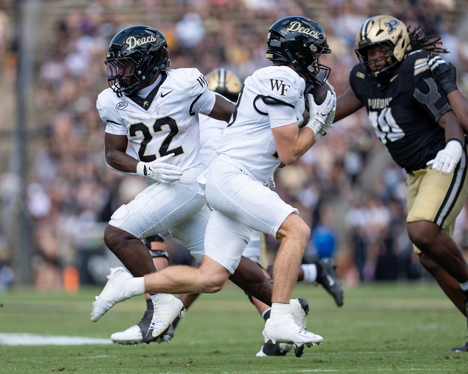 WEST LAFAYETTE, IN - SEPTEMBER 12, 2026: Wake Forest University Running Back Deuce Lawrence (22) hands off the reverse to Wake Forest University Wide Receiver Drayden Dickmann (18) during the Purdue Boilermakers football game vs the Wake Forest Demon Deacons at Ross-Ade Stadium(Photo by Steve Bowen / Northern Indiana Sports Report)