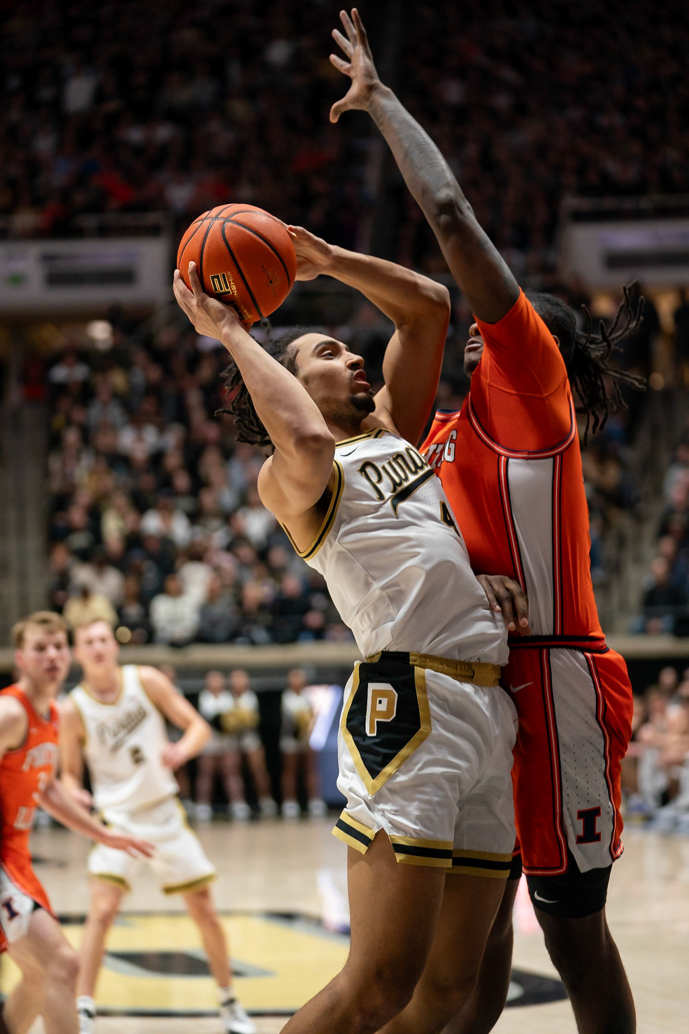 WEST LAFAYETTE, IN - JANUARY 5, 2024: Purdue Sophomore Forward Trey Kaufman-Renn (4) puts up a shot while Illinois Redshirt Junior Forward/Center Dain Dainja (42) tries to block him in Purdue Boilermaker's Basketball vs the Illinois Fighting Illini at Mackey Arena(Photo by Steve Bowen / Bowen Arrow Photography / Northern Indiana Sports Report)