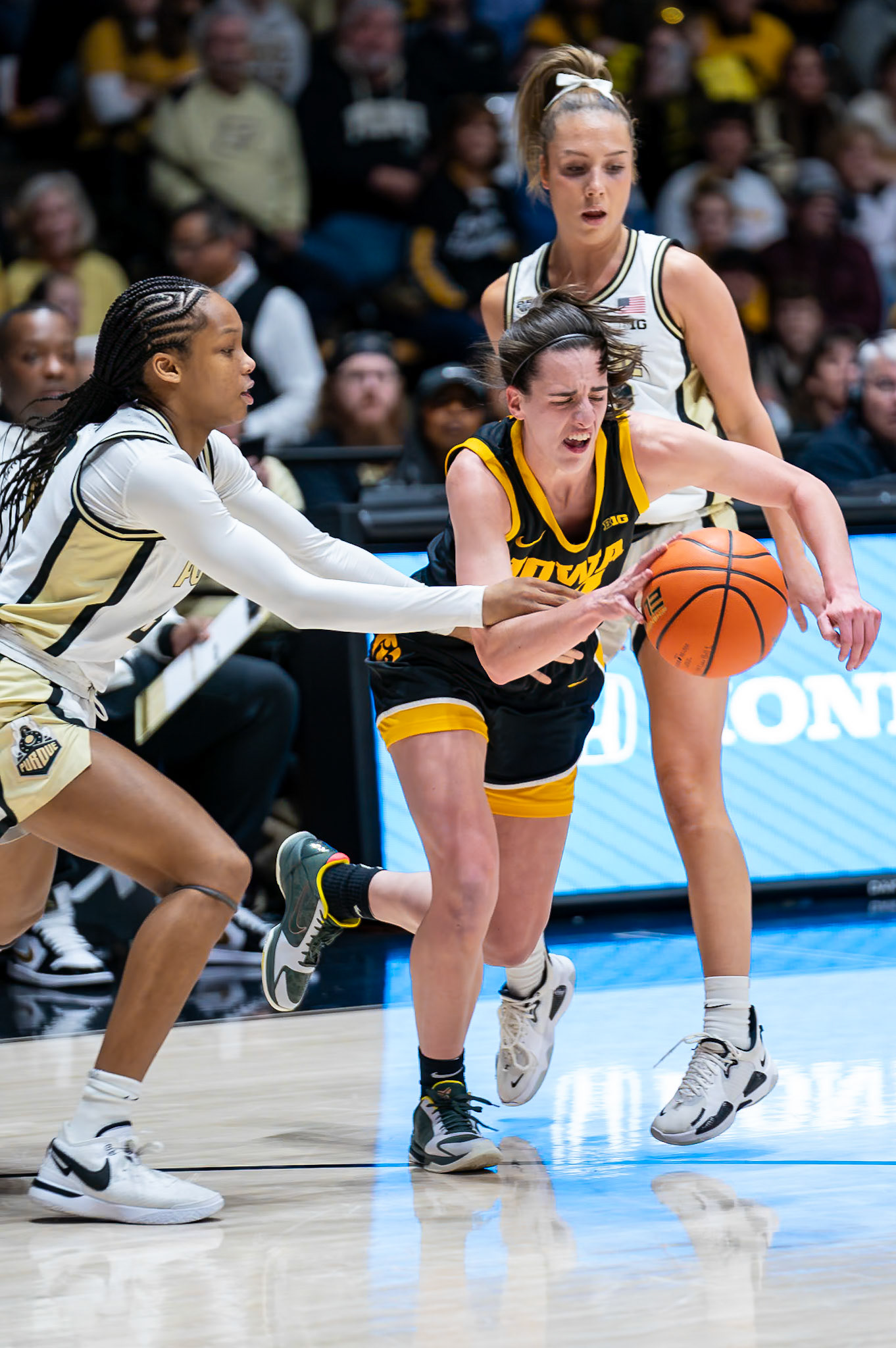 WEST LAFAYETTE, IN - JANUARY 10, 2024: Iowa Guard Senior Caitlin Clark (22), Purdue Junior Guard Jayla Smith (3), Purdue 5th Year Guard Abbey Ellis (23) competing in Purdue Boilermaker Women's Basketball vs the Iowa Hawkeyes at Mackey Arena(Photo by Steve Bowen / Bowen Arrow Photography / Northern Indiana Sports Report)