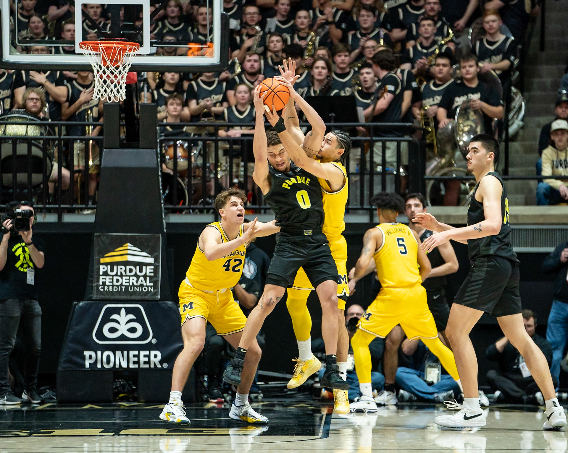 WEST LAFAYETTE, IN - JANUARY 23, 2024: Purdue Senior Forward Mason Gillis (0), Michigan Graduate Forward Olivier Nkamhoua (13), Michigan Redshirt Sophomore Forward Will Tschetter (42) competing in Purdue versus Michigan Mens Basketball at Mackey Arena(Photo by Steve Bowen / Bowen Arrow Photography / Northern Indiana Sports Report)
