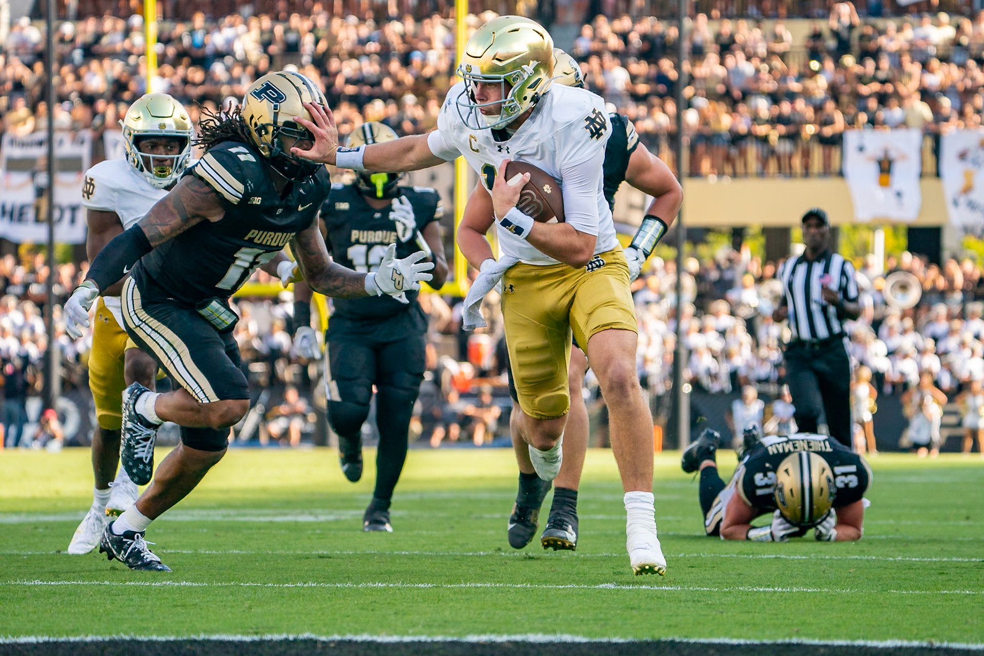 WEST LAFAYETTE, IN - SEPTEMBER 14, 2024: Notre Dame Senior QB Riley Leonard (13), Purdue Sr. Defensive Back Antonio Stevens (11) during the Purdue University Boilermakers vs Notre Dame Fighting Irish Football game at Ross-Ade Stadium(Photo by Steve Bowen / Bowen Arrow Photography / Northern Indiana Sports Report)