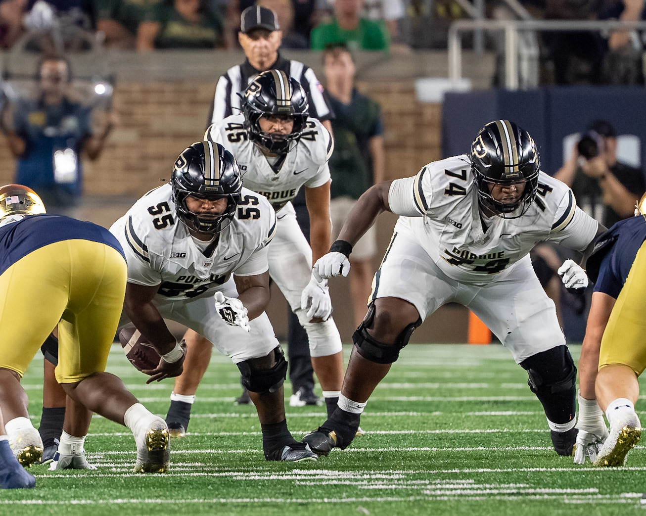 SOUTH BEND, IN - SEPTEMBER 20, 2025: Purdue University Sophomore Offensive Lineman Bradyn Joiner (55) snaps the ball as Purdue University Senior Offensive Lineman Jalen St. John (74) moves to block the defender during the Purdue Boilermakers at Notre Dame Fighting Irish Football at Notre Dame Stadium(Photo by Steve Bowen / Northern Indiana Sports Report)