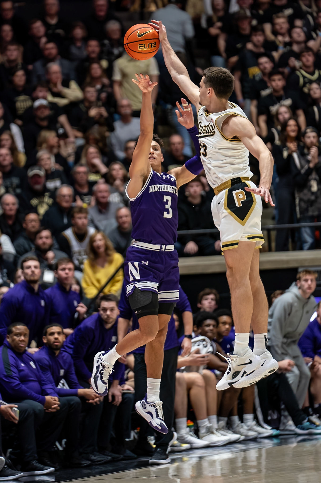 WEST LAFAYETTE, IN - JANUARY 31, 2024: Northwestern Senior Guard Ty Berry (3), Purdue Redshirt Freshman Forward Camden Heide (23) competing in Purdue Boilermakers Mens Basketball versus the Northwestern Wildcats at Mackey Arena(Photo by Steve Bowen / Bowen Arrow Photography / Northern Indiana Sports Report)