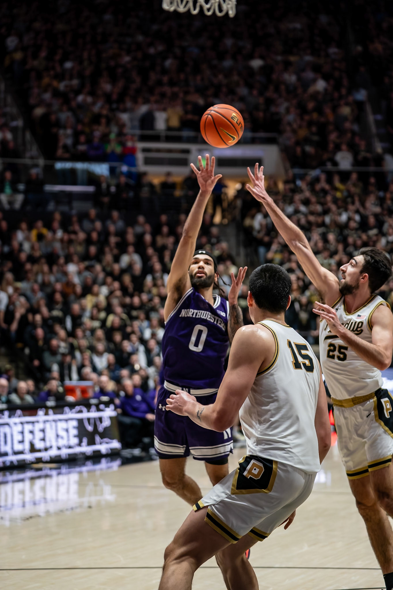WEST LAFAYETTE, IN - JANUARY 31, 2024: Northwestern Graduate Guard Boo Buie (0), Purdue Senior Guard Ethan Morton (25) competing in Purdue Boilermakers Mens Basketball versus the Northwestern Wildcats at Mackey Arena(Photo by Steve Bowen / Bowen Arrow Photography / Northern Indiana Sports Report)