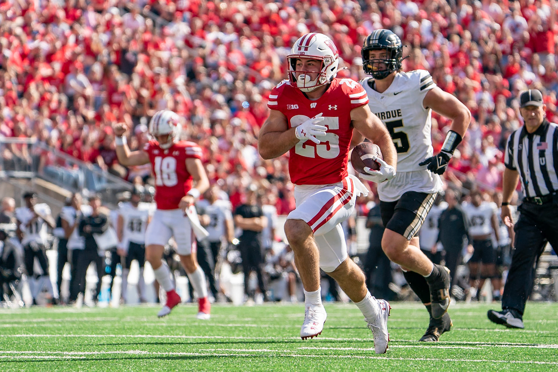 MADISON, WI - OCTOBER 5, 2024: University of Wisconsin Redshirt Sophomore RB Cade Yacamelli (25) breaks free on a run during the Purdue University Boilermakers at University of Wisconsin Badger Football game at Camp Randall Stadium(Photo by Steve Bowen / NISports Report)