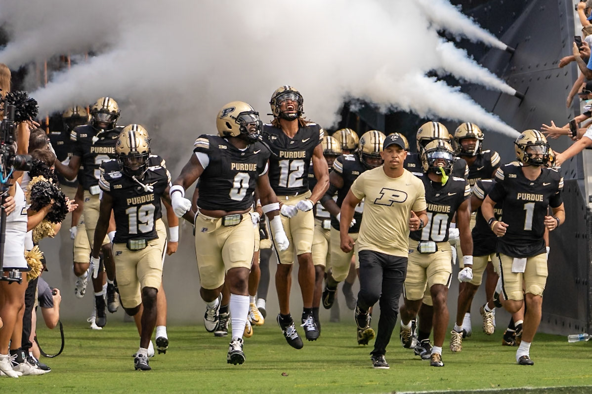 WEST LAFAYETTE, IN - AUGUST 31, 2024: Purdue Football Head Coach Ryan Walters, Purdue Sr. DL Jeffrey M'Ba (0), Purdue Fr. DB Tarrion Grant (12), Purdue Sr. QB Hudson Card (1), Purdue Jr. DB Botros Alisandro (19), Purdue Jr. DB Kyndrich Breedlove (10)lead the Boilermakes out of the Tiller Tunnel at the Purdue vs Indiana State football game at Ross-Ade Stadium(Photo by Steve Bowen / Bowen Arrow Photography / Northern Indiana Sports Report)