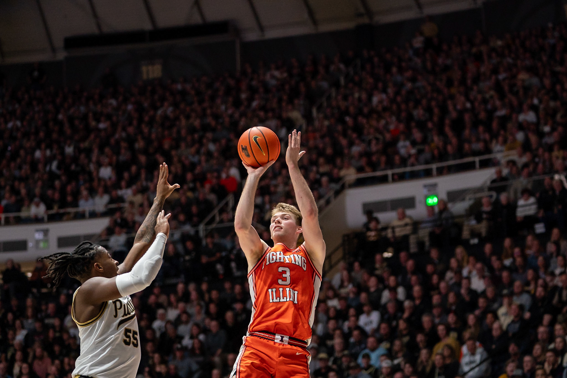 WEST LAFAYETTE, IN - JANUARY 5, 2024: Illinois Graduate Guard/Forward Marcus Domask (3) puts up a shot against Purdue 5th year Guard Lance Jones (55) in Purdue Boilermaker's Basketball vs the Illinois Fighting Illini at Mackey Arena(Photo by Steve Bowen / Bowen Arrow Photography / Northern Indiana Sports Report)