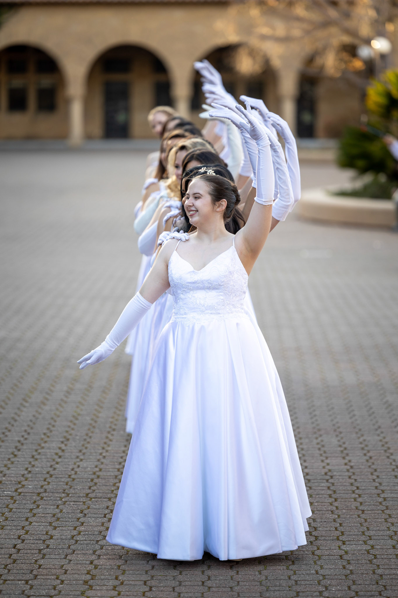 The Viennese Ball Opening Committee poses for a photoshoot on main quad