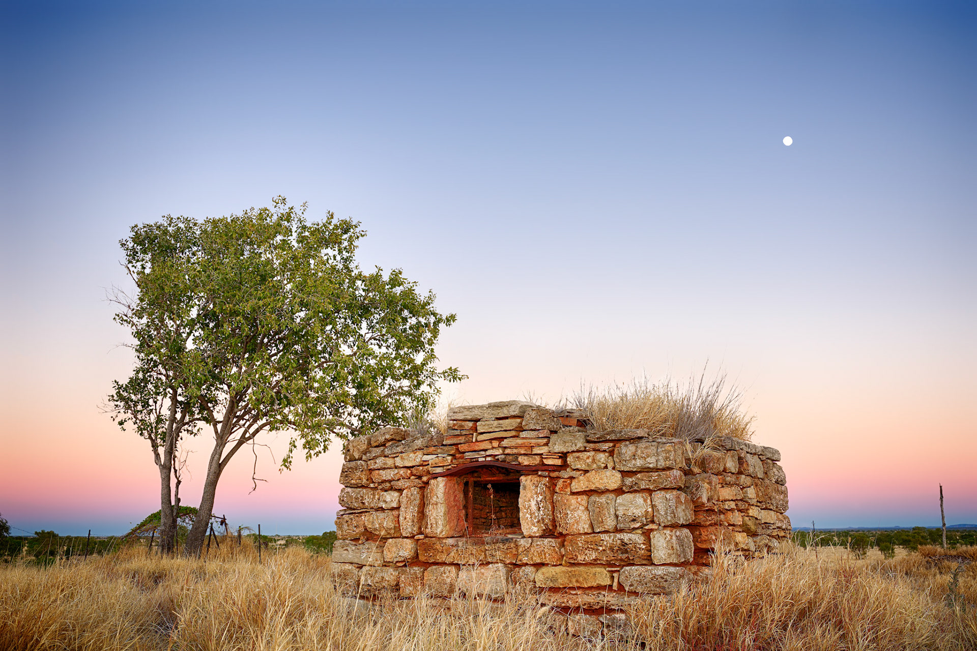 The Cook's Ghost / The cooks ghost passes by In the dawn light under the full moon. The old oven at the remains of the Ord River Station along Duncan Road in the East Kimberleys, Western Australia.