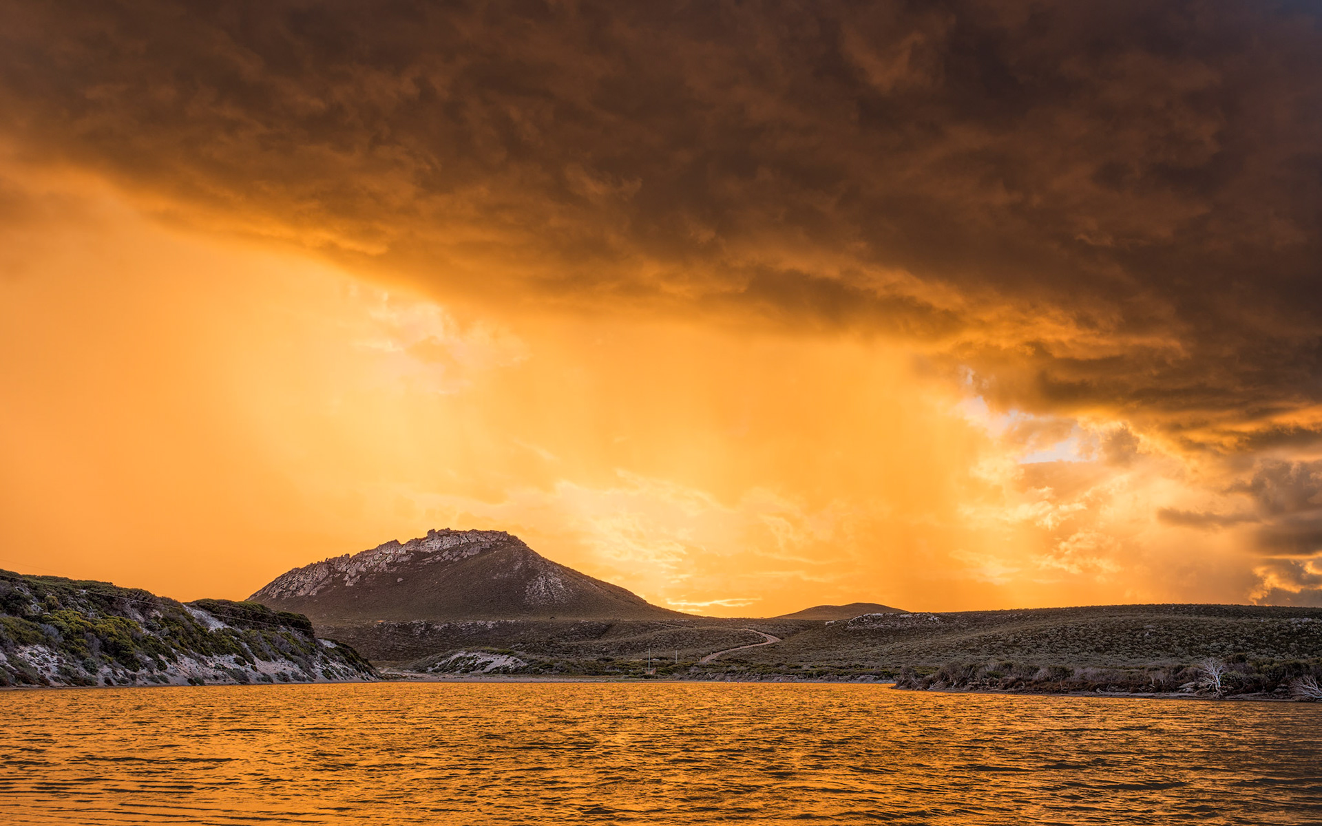 Orange Storm / Such different colours. A storm approaches at sunset over the Culham Inlet in Fitzgerald River National Park, Western Australia