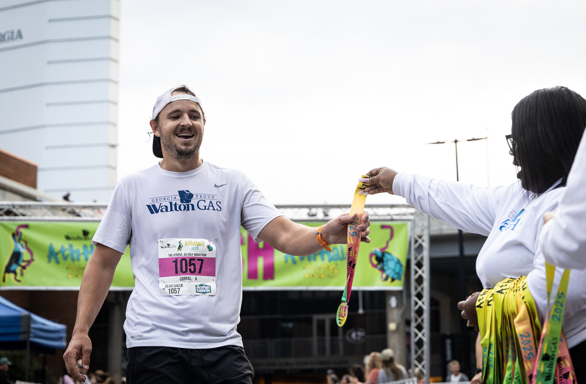 Brandon Lowrance collects his medal after crossing the finish line at the AthHalf half marathon in Athens, Georgia on Sunday, Oct. 12, 2025. AthHalf is a fundraiser for Athfest Educates, which awards grants to schools, nonprofits and government agencies. (Photo/Emily Laycock)