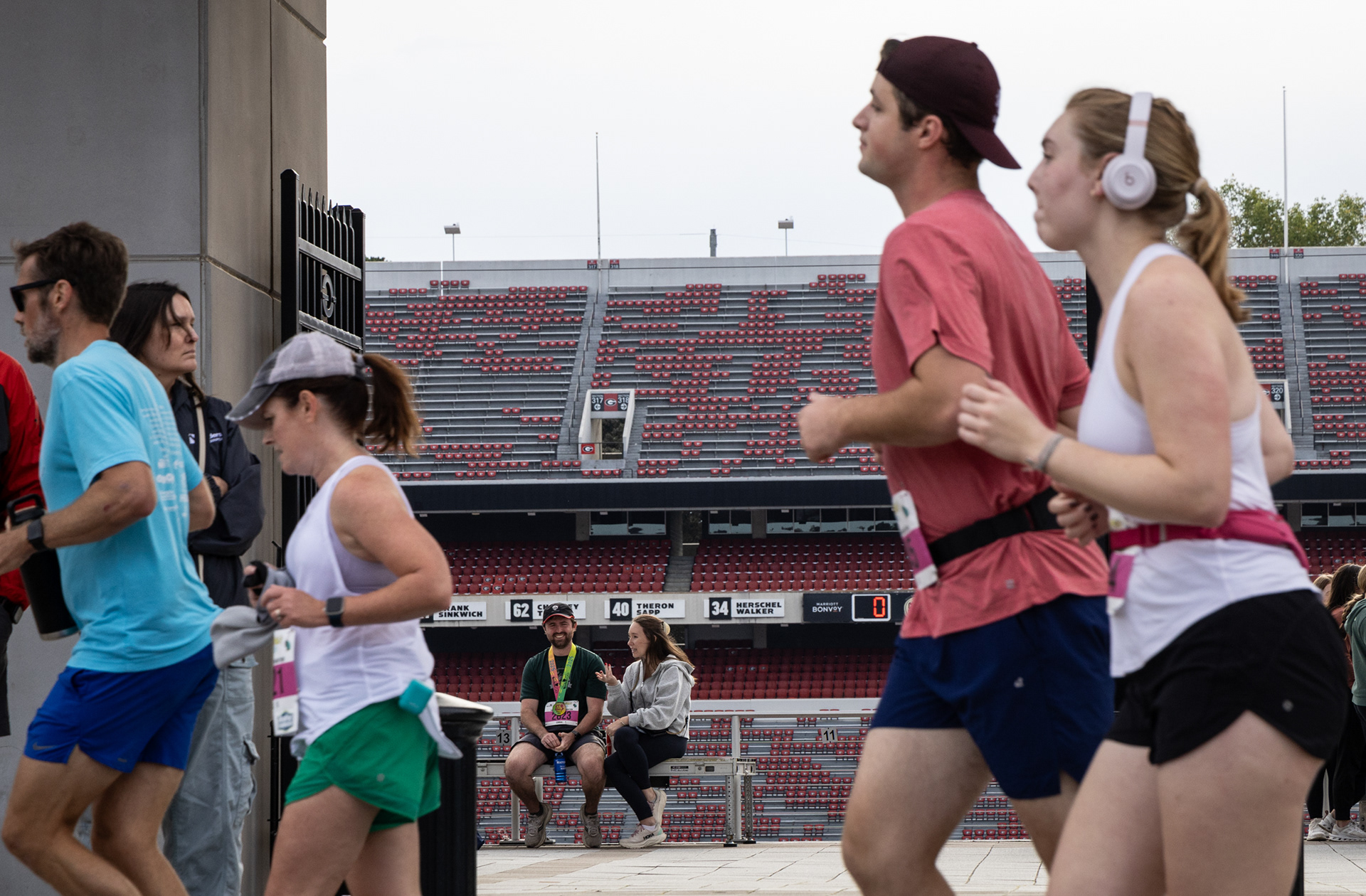 Runners pass by Sanford Stadium during the AthHalf half marathon in Athens, Georgia on Sunday, Oct. 12, 2025. AthHalf is a fundraiser for Athfest Educates, which awards grants to schools, nonprofits and government agencies. (Photo/Emily Laycock)