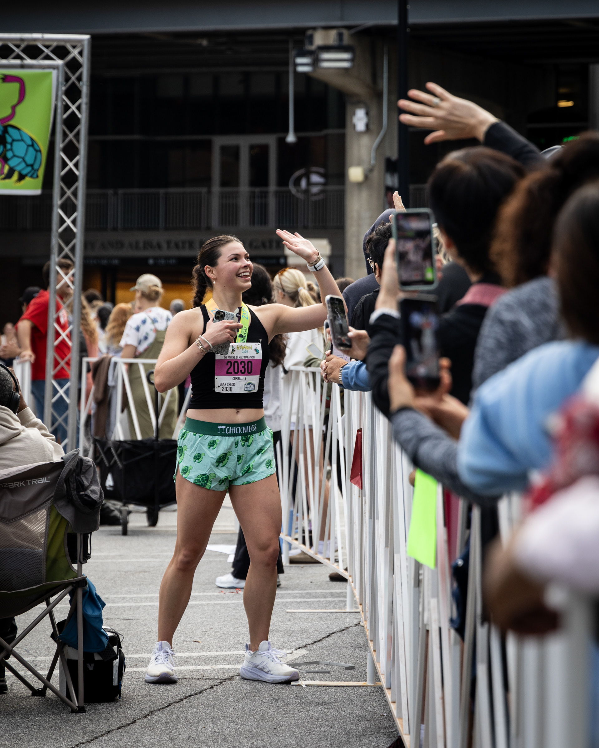 Eliana celebrates after crossing the finish line at the AthHalf half marathon in Athens, Georgia on Sunday, Oct. 12, 2025. AthHalf is a fundraiser for Athfest Educates, which awards grants to schools, nonprofits and government agencies. (Photo/Emily Laycock)