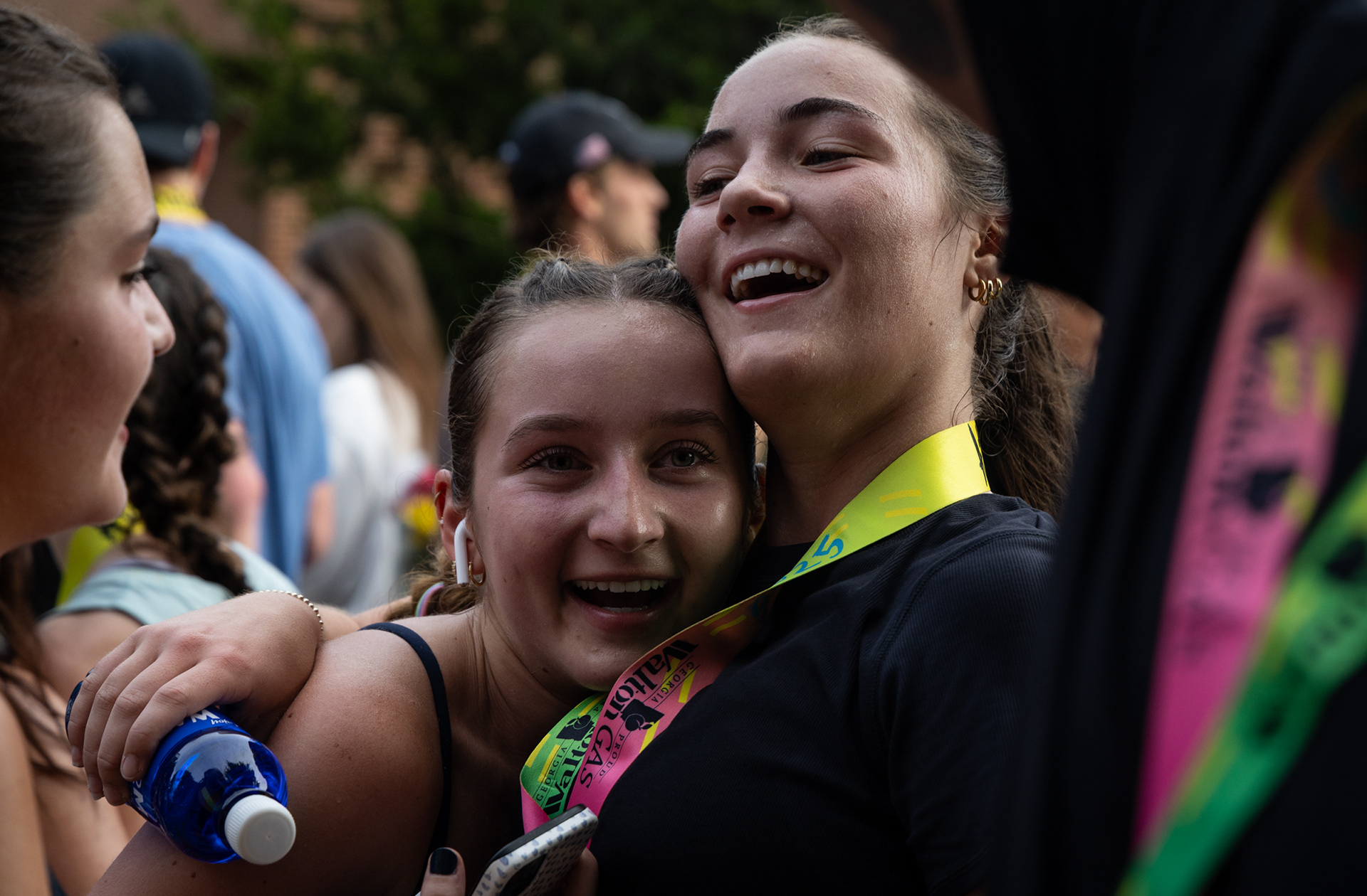 Runners celebrate after crossing the finish line at the AthHalf half marathon in Athens, Georgia on Sunday, Oct. 12, 2025. AthHalf is a fundraiser for Athfest Educates, which awards grants to schools, nonprofits and government agencies. (Photo/Emily Laycock)