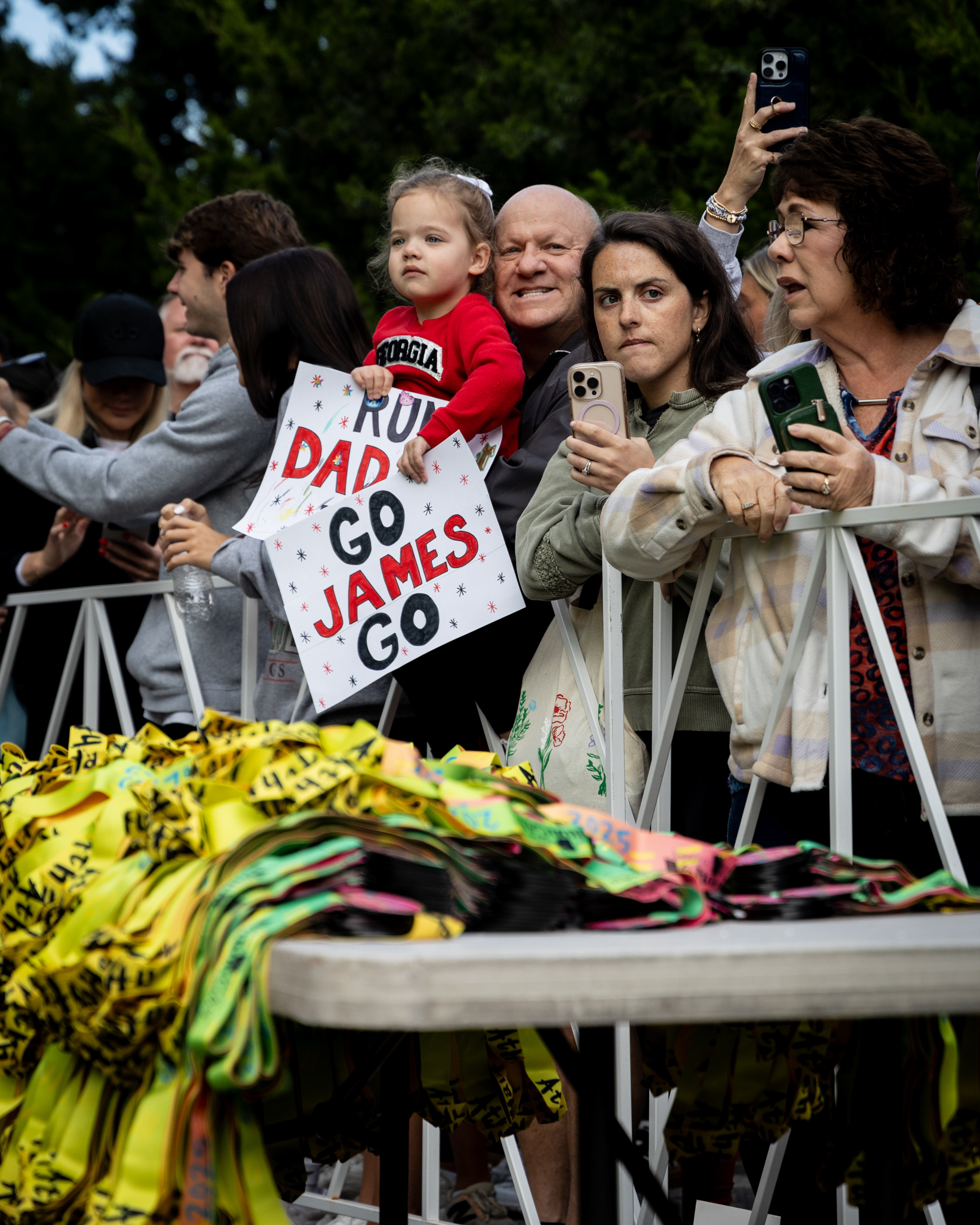 Spectators wait at the finish line of the AthHalf half marathon in Athens, Georgia on Sunday, Oct. 12, 2025. AthHalf is a fundraiser for Athfest Educates, which awards grants to schools, nonprofits and government agencies. (Photo/Emily Laycock)