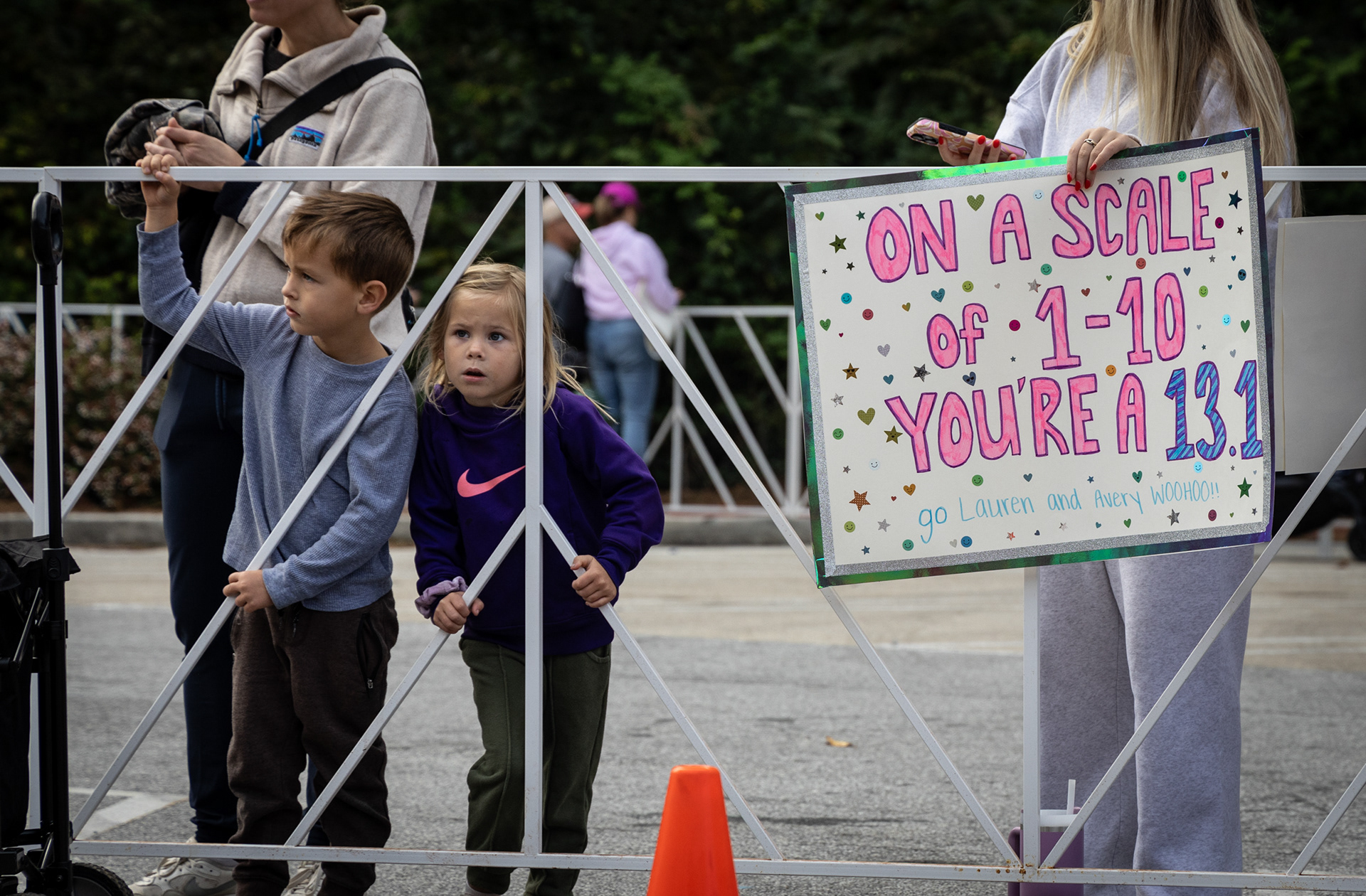 Spectators wait at the finish line of the AthHalf half marathon in Athens, Georgia on Sunday, Oct. 12, 2025. AthHalf is a fundraiser for Athfest Educates, which awards grants to schools, nonprofits and government agencies. (Photo/Emily Laycock)