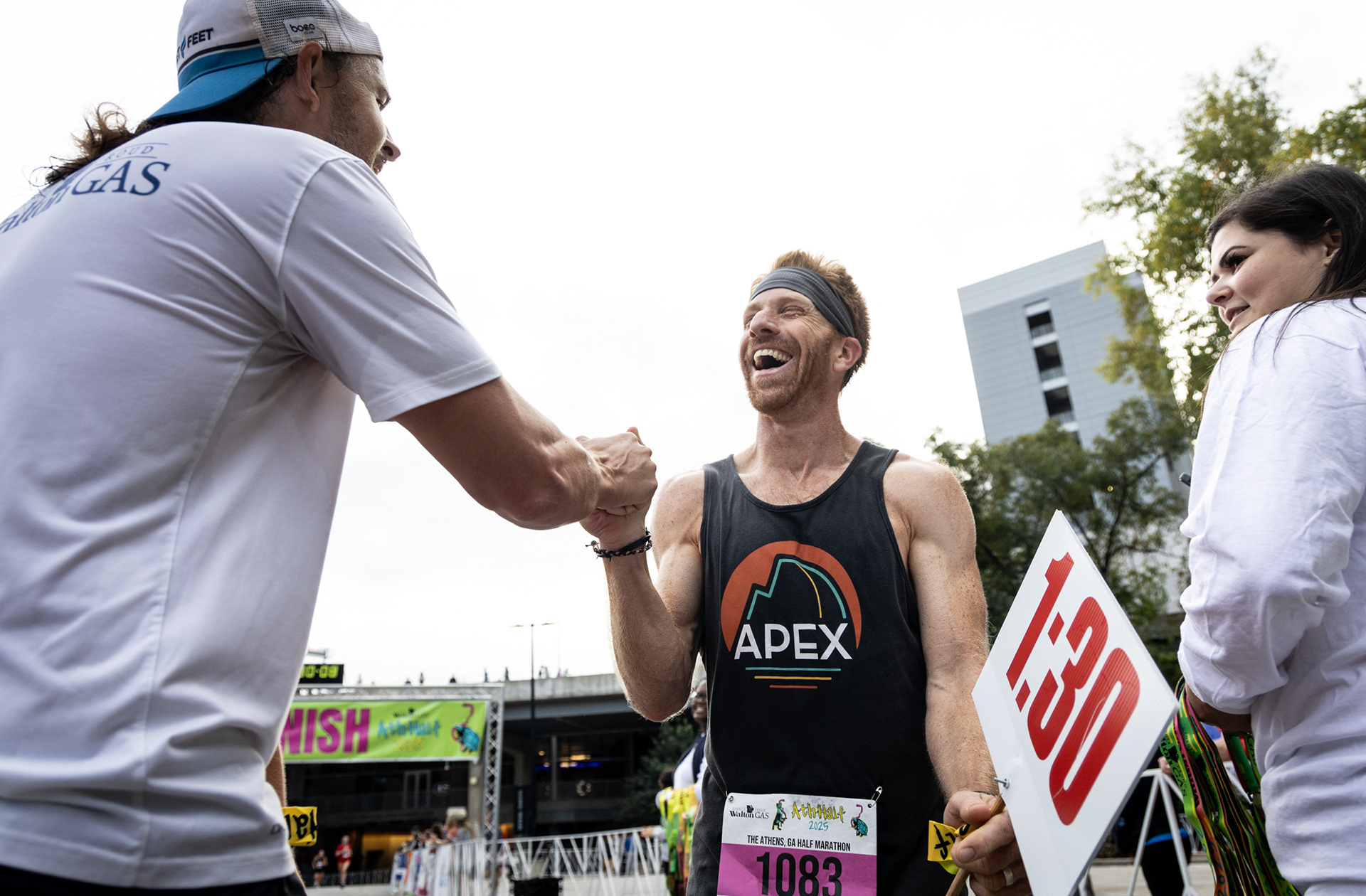 Brandon Lowrance and Christopher Fitzgerald celebrate after crossing the finish line at the AthHalf half marathon in Athens, Georgia on Sunday, Oct. 12, 2025. AthHalf is a fundraiser for Athfest Educates, which awards grants to schools, nonprofits and government agencies. (Photo/Emily Laycock)