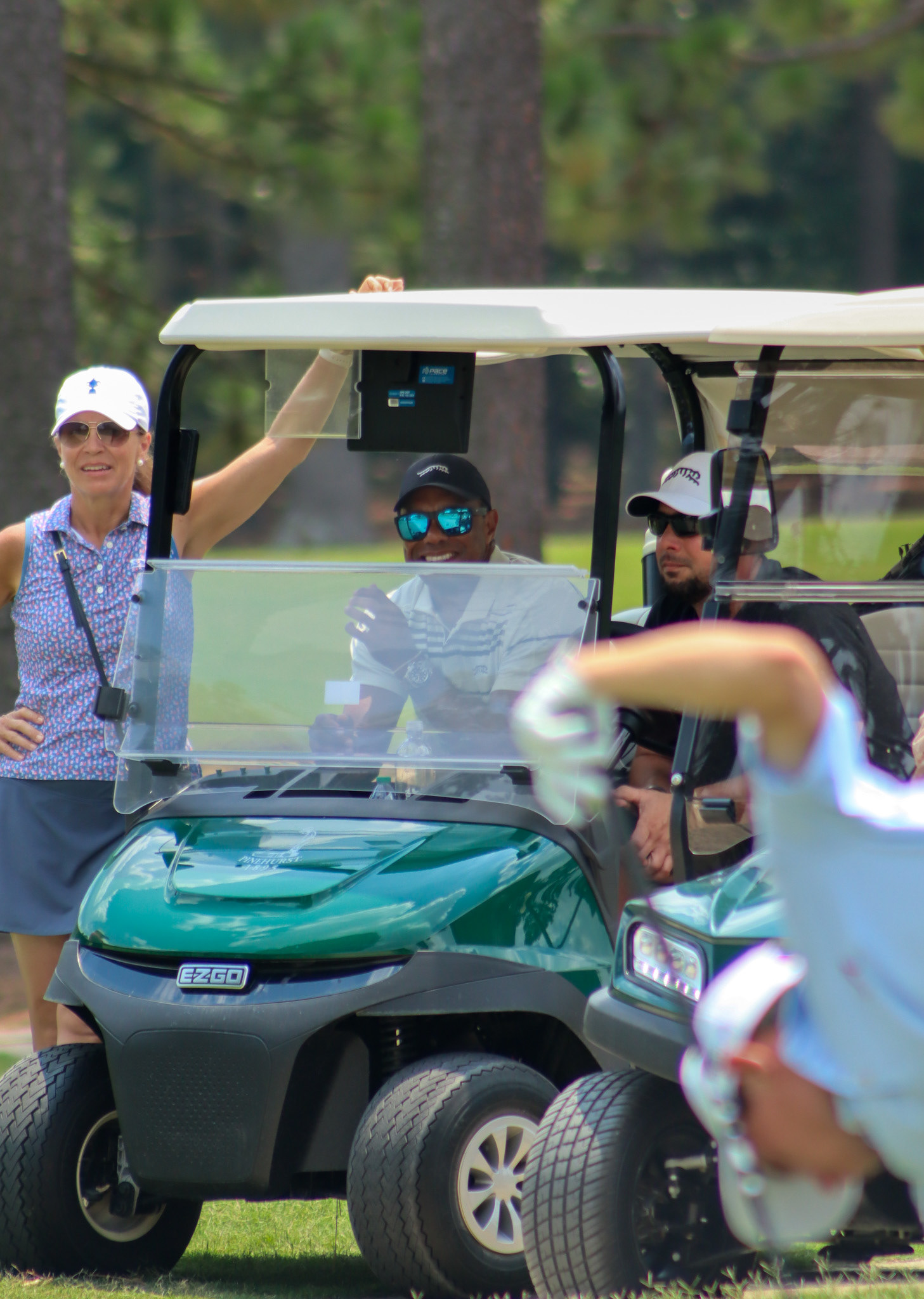 Tiger Woods watching his son tee off 