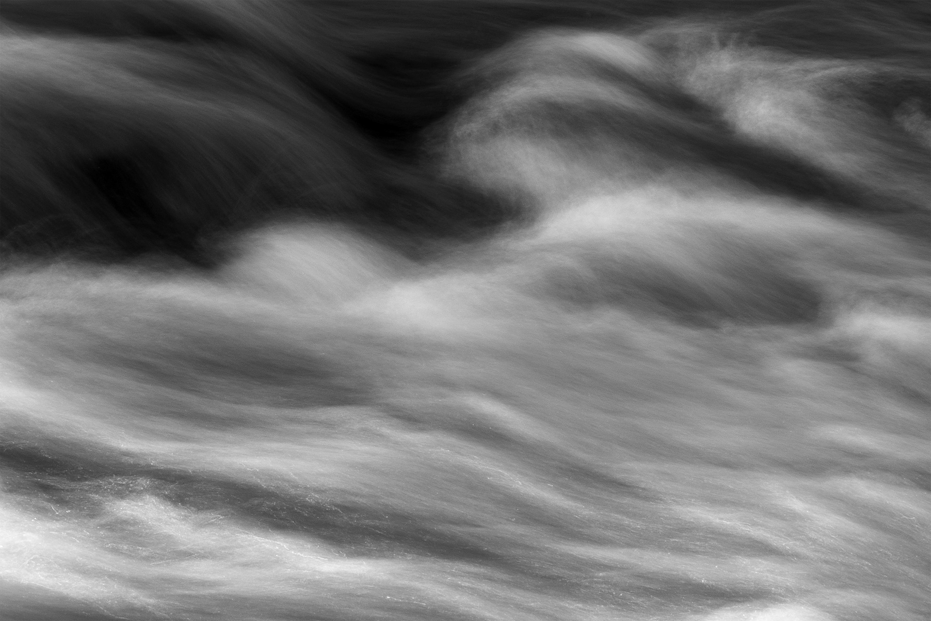 Long exposure study of moving water with abstract tonal flow. Visual artwork by Bucchianeri.
